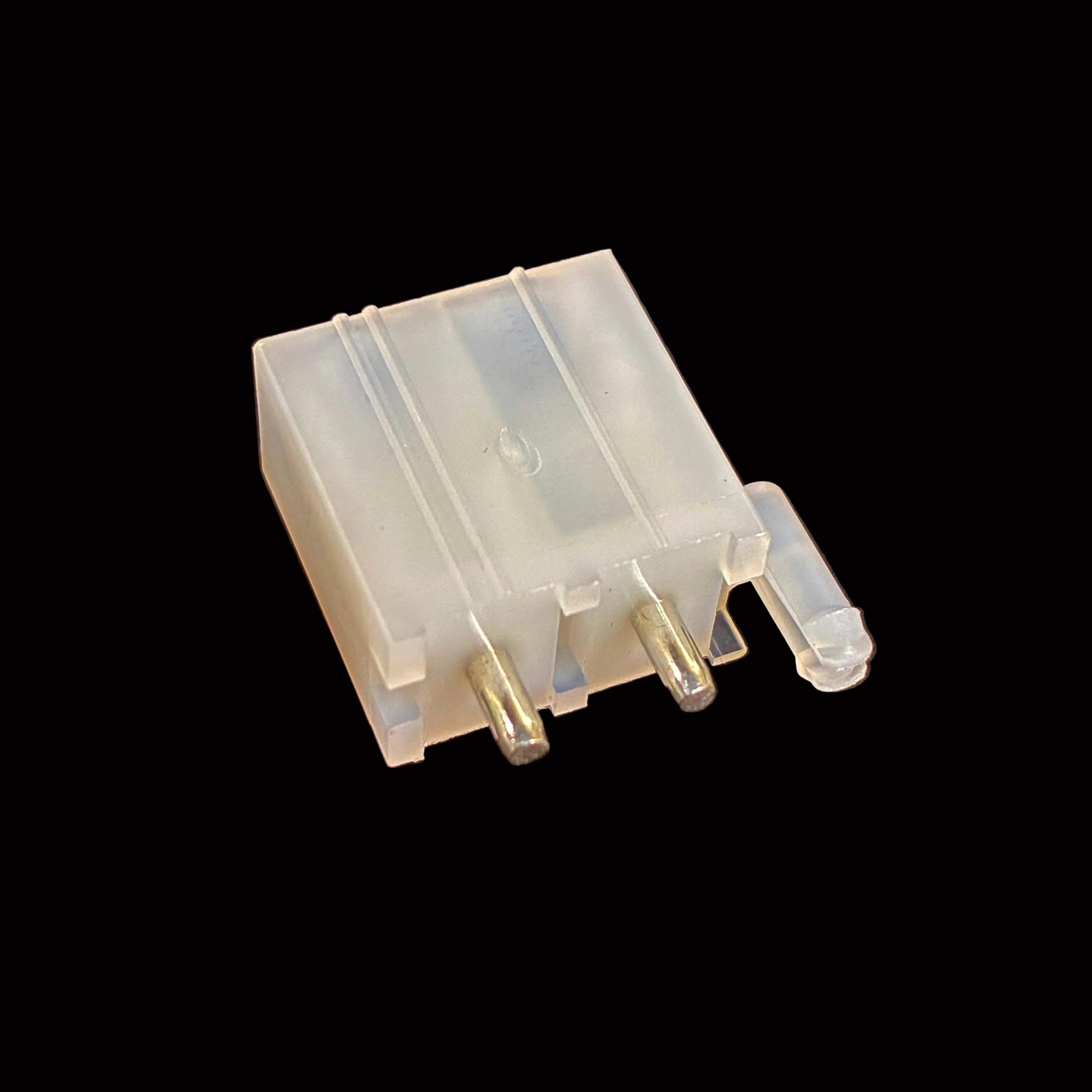 A small translucent plastic electronic component with three metal pins, photographed on a black surface.